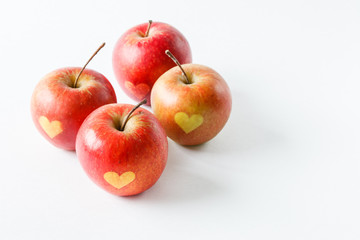 Red apples with a heart symbol
