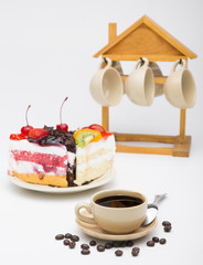 cup of coffee and delicious cake on white background