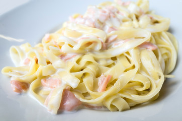 tasty pasta with salmon on a the table
