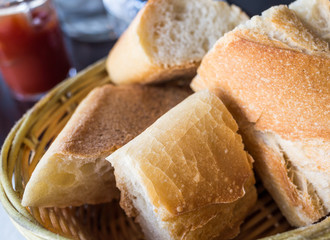 bread in basket - little roll breads in basket on table