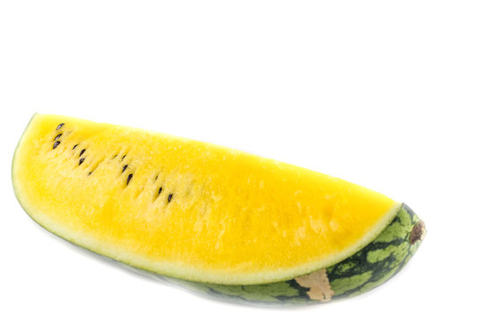 Yellow juicy watermelon slice on white