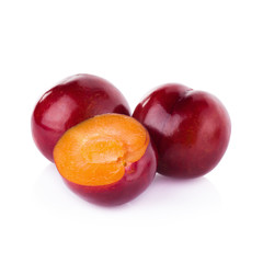 plums isolated on white