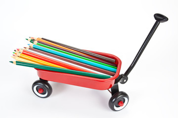 Red wagon with colorful pencils