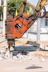 Machine pneumatic hammer drill  breaking asphalt concreat at roa