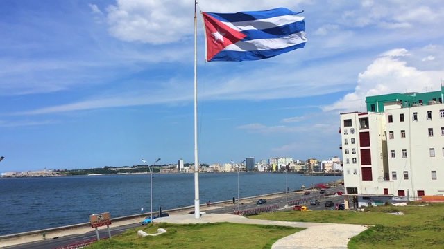 Cuba Waving Flag with Havana on background
