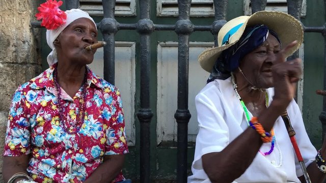 Cubans smoking cigar in Havana, Cuba