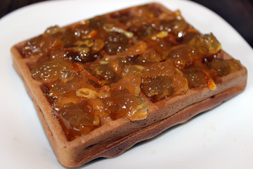 chocolate wafer with orange marmalade close up, captured with a small depth of field