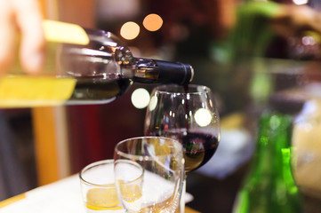 Pouring red wine into the glass