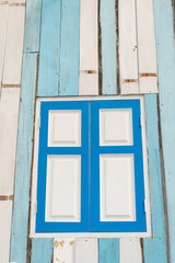 Obraz na płótnie Canvas Colorful aged wooden window frame