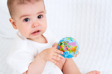 Baby and globe. Isolated on white background