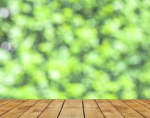Wood floor and spring green bokeh background