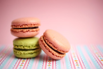 Colorful macaroons on pink