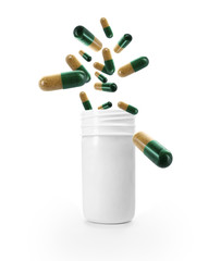 Bright pills flying away from open plastic bottle isolated on white