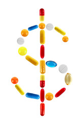 Dollar sign made with pills isolated on white