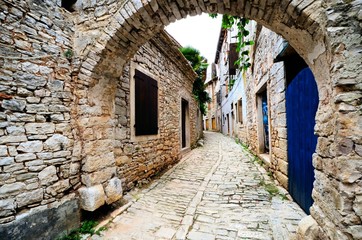 Ancient arched medieval street in an old village in Istria, Croatia