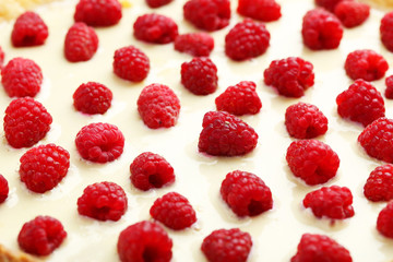 Sweet tart cake with raspberries background