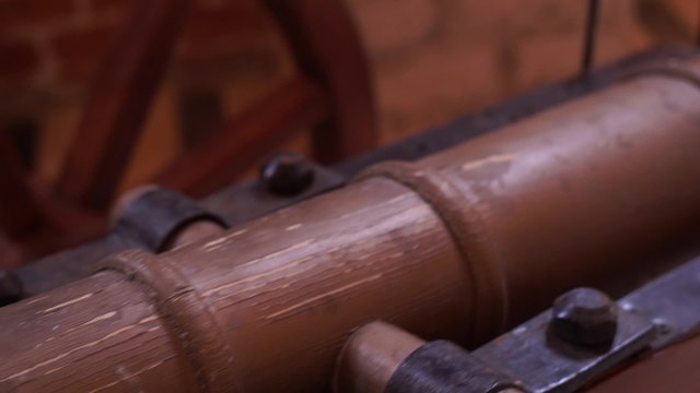 antique cannon on wooden wheels