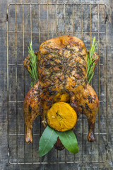Festive roast duck stuffed with orange