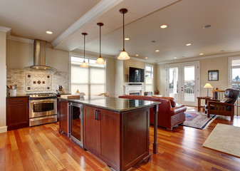 State of the art kitchen with deep stained wood.