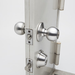 Door knobs, aluminum door white background.