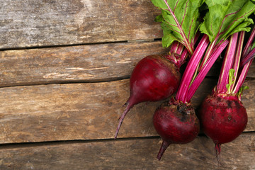 Young beets on wooden table