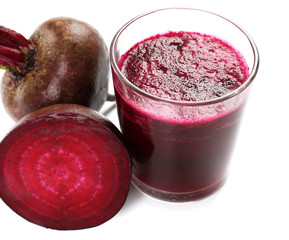 Glass of beet juice with vegetables isolated on white