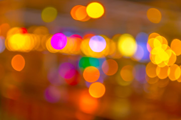 Obraz premium blurred bokeh background with warm orange lights (blurred)