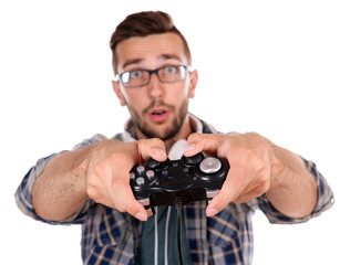 Young man playing video games isolated on white