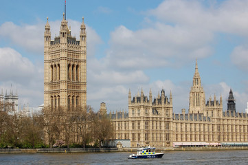Patrol police boat on the Thames river in London, UK.