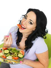Young Woman Eating a Fresh Crisp Mixed Garden Salad