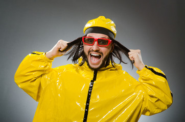 Man wearing yellow suit in funny concept