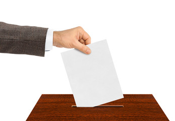 Hand with paper ballot