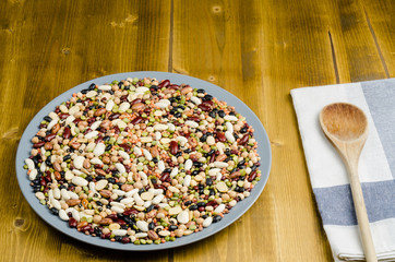 legumes in a dish on wood, close up, background
