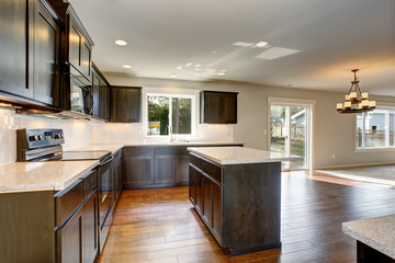 Modern kitchen with stained cabinets.