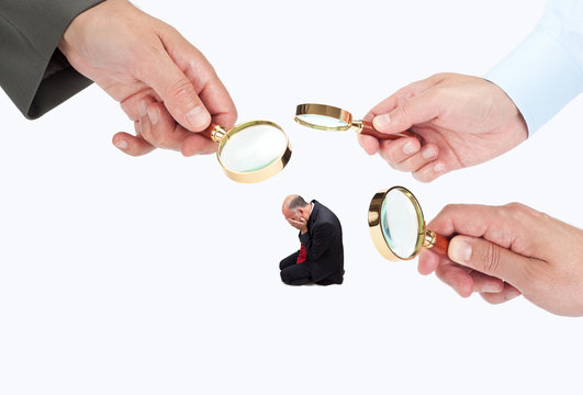 Hands with magnifier glasses looking, studying or selecting a person