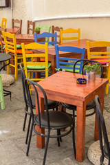 Fototapeta na wymiar Street cafe with colorful chairs