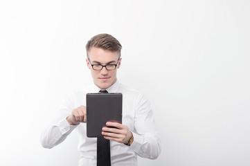 Businessman holding tablet on isolated background 