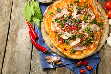 Tasty pizza with vegetables on table close up