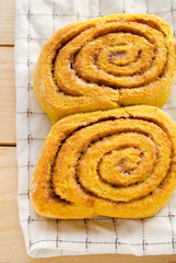 Pumpkin cinnamon rolls with spices and sweet cream