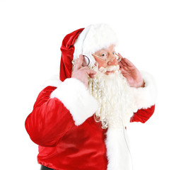 Santa Claus with headphones listening to music, isolated on white background