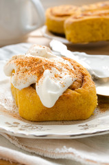 Pumpkin cinnamon rolls with spices and sweet cream