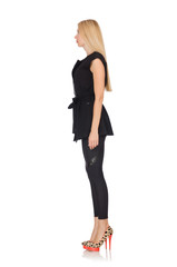 Pretty woman in tight black pants isolated on white