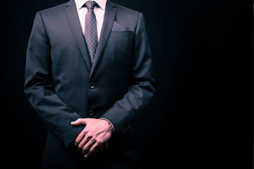 man in suit on a black background