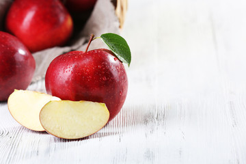 Ripe red apples on table close up