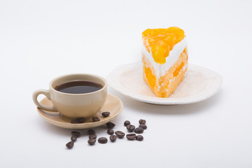 cup of coffee and delicious cake on white background