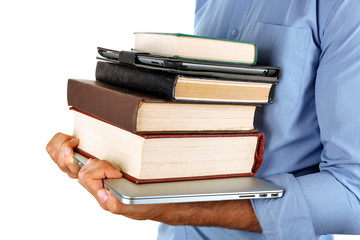Man holding stack of books with laptop and tablet isolated on white