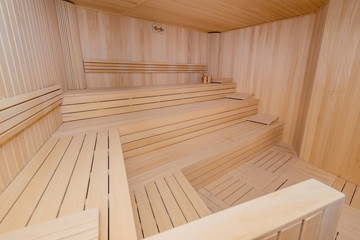 Fototapeta na wymiar Hot wooden sauna room interior