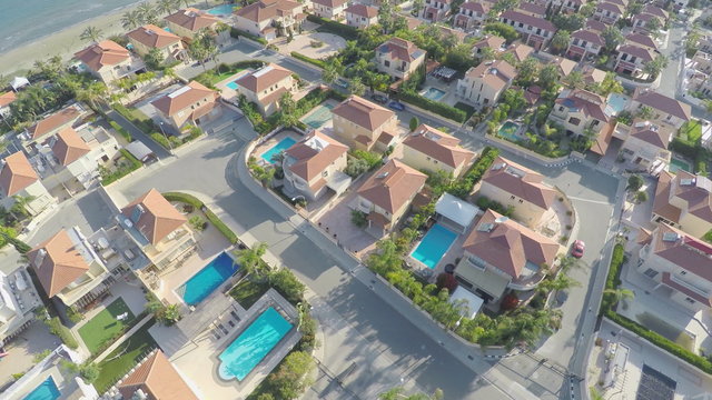 Top view of houses with swimming pools for rent. Vacation at resort. Aerial