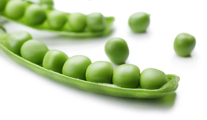 Fresh green peas isolated on white