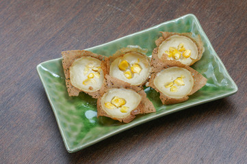 Knmcrk, Kind of Thai sweetmeat, made from coconut milk with sugar and flour.